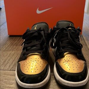 Nike Jordan’s  Black and Gold Sneakers with Metallic Accents